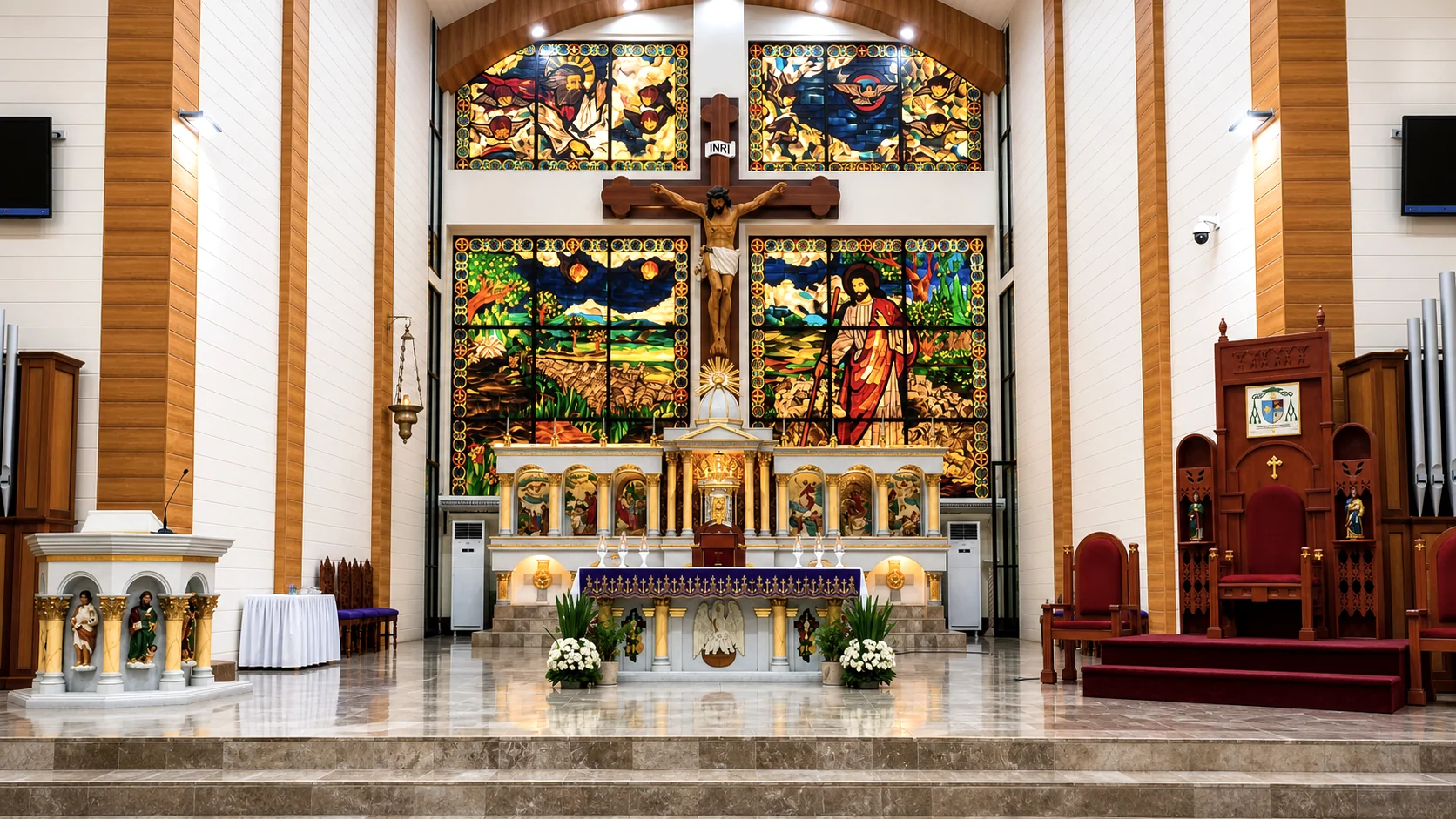 Main altar framed by stained glass at Cathedral-Shrine and Parish of the Good Shepherd