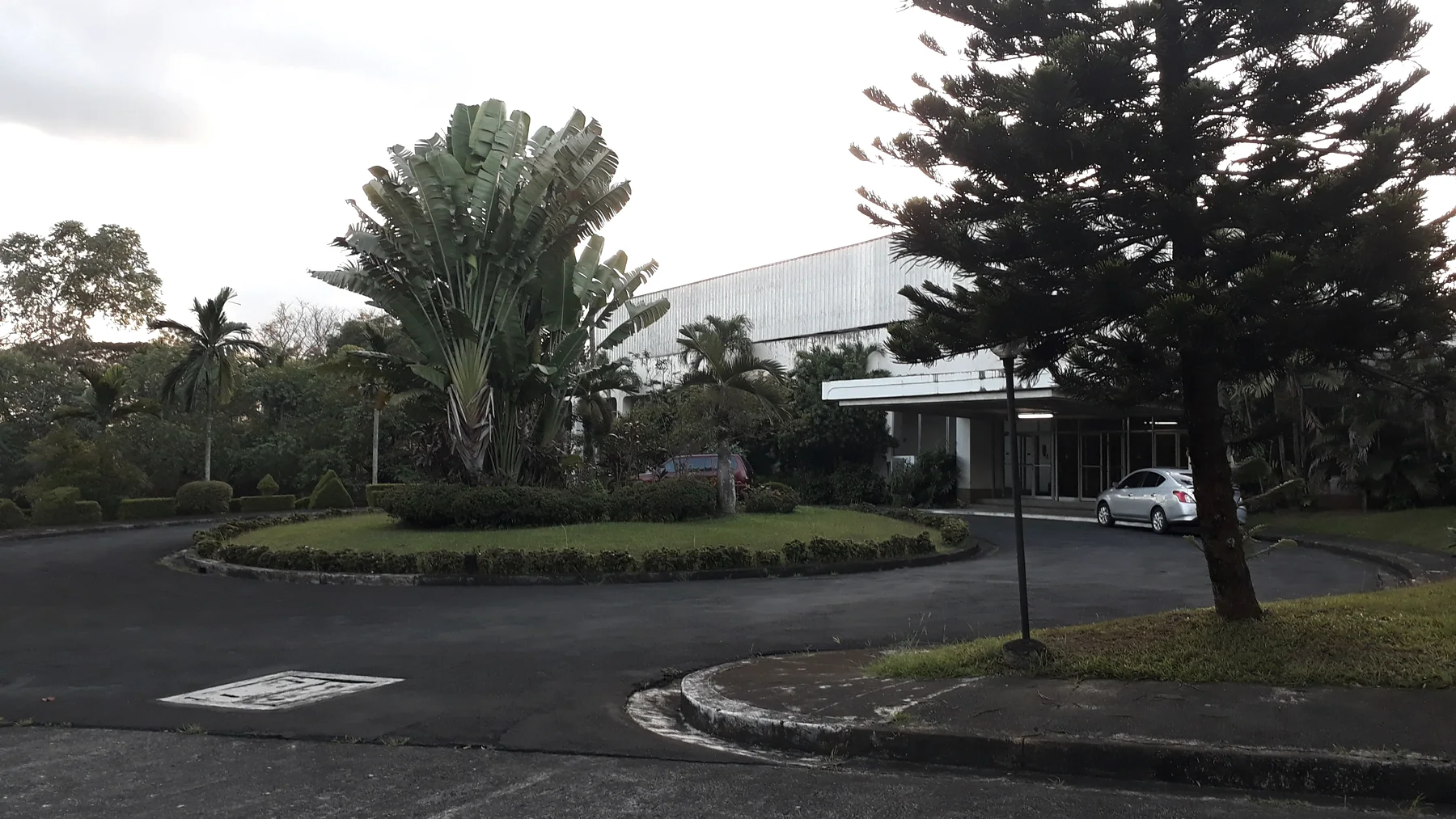 Radio Veritas Asia Function Hall driveway with tropical landscaping